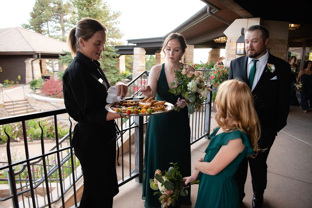 Server Passing Appetizers to Bridal Party